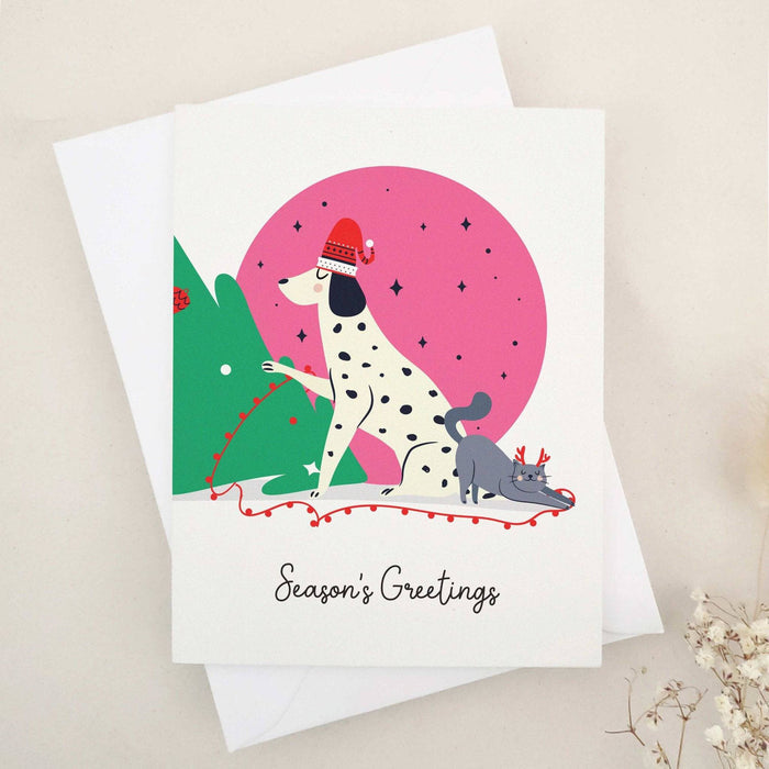 Season’s Greetings Christmas card featuring Dalmatian dog and cat illustration with festive design – XOXOKristen